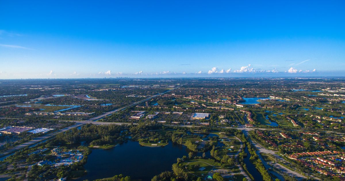 Suburban waterfront and palm-lined development in Pembroke Pines, Florida