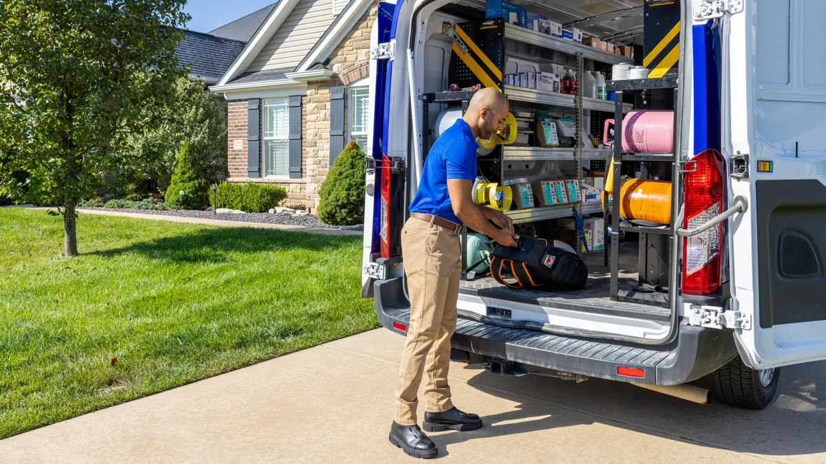 Home-service contractor preparing for a local service call